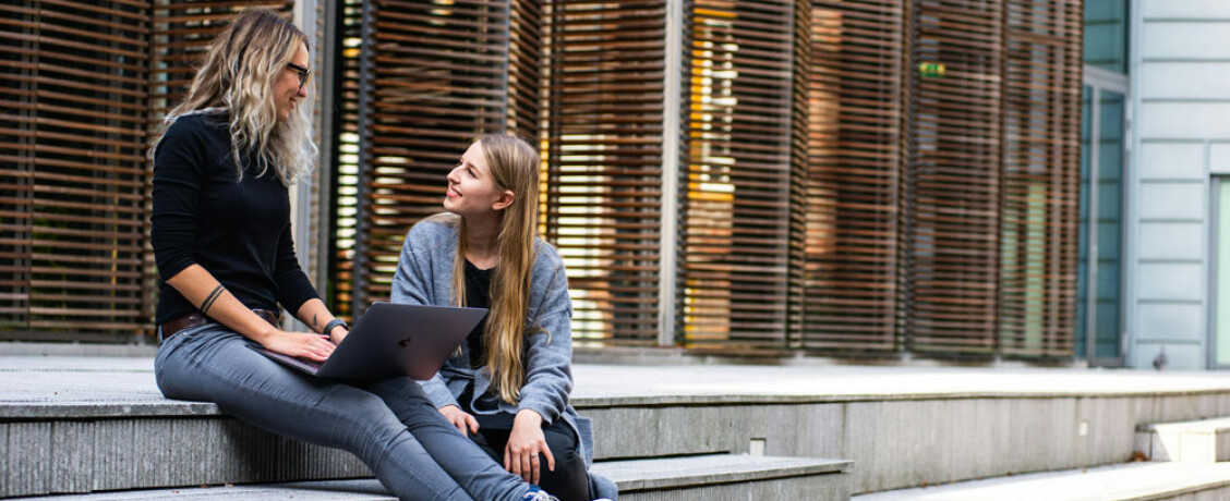 Students talking on steps